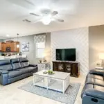 Spacious living area with large TV