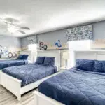 Spacious bedroom with cartoon wall art