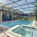 Sunny pool area with spa