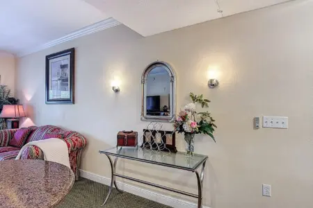 Bright and open living space with stylish mirror accents