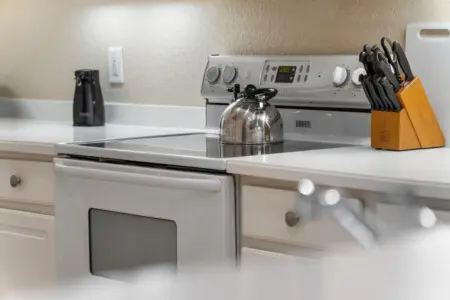 Featuring a variety of home appliances, this kitchen is equipped to make cooking easy and enjoyable.