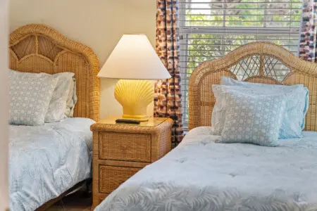Comfortable twin beds with fresh linens and plenty of natural light.
