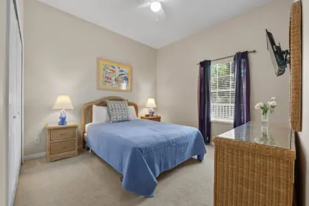 Cozy single bedroom with natural light and relaxing ambiance.