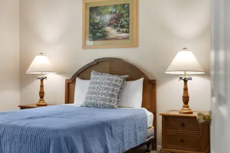 Cozy single bedroom with natural light and relaxing ambiance.