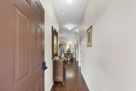 Welcoming hallway that leads to bedrooms and shared living spaces.