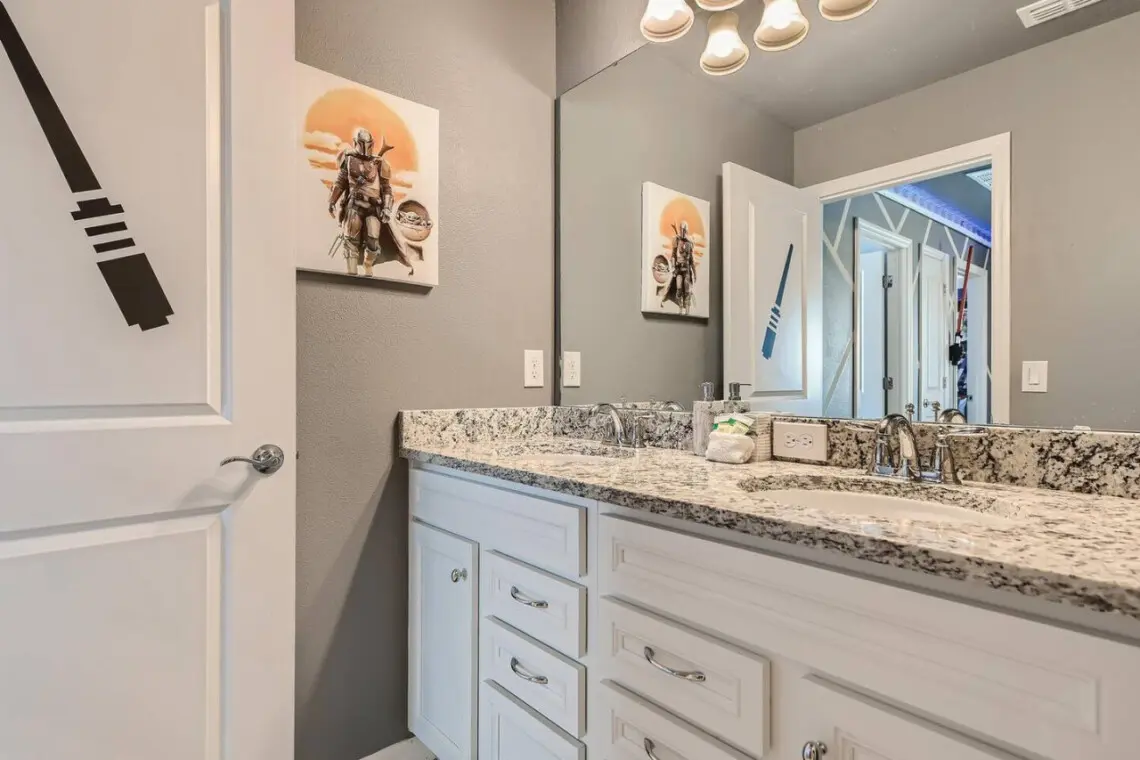 Spacious double-sink bathroom with artwork