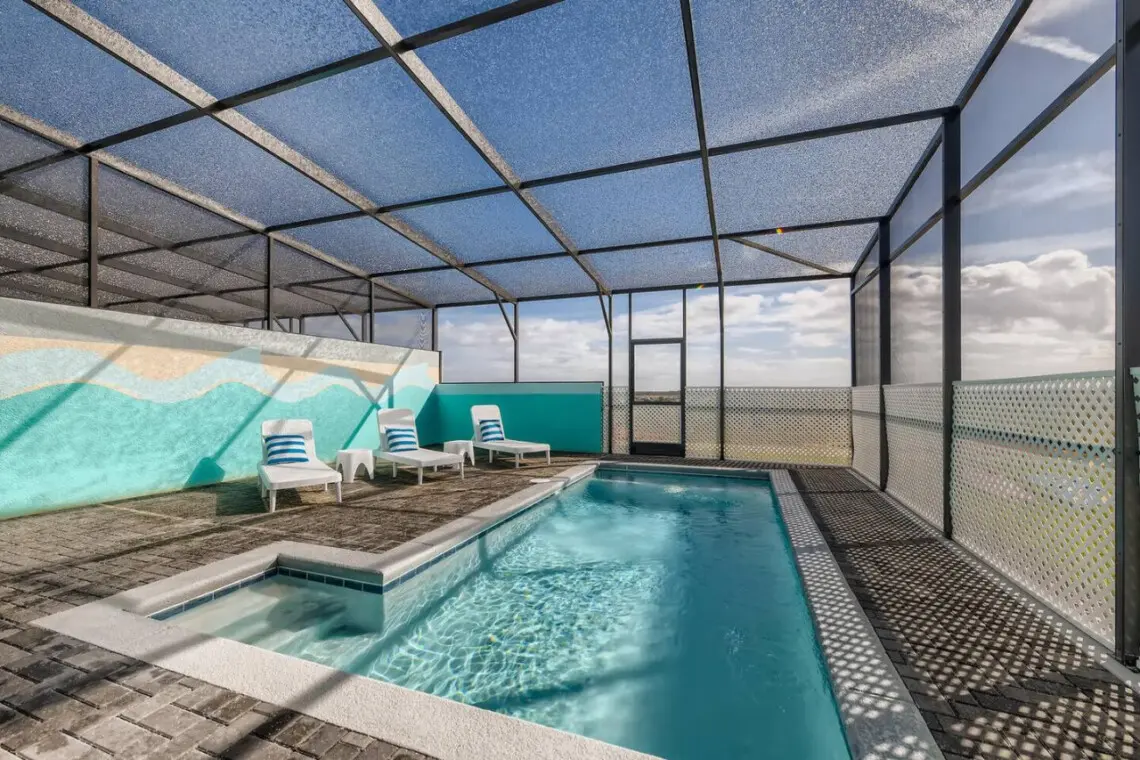Screen-enclosed pool with spa