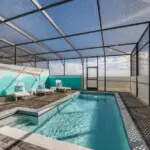 Screen-enclosed pool with spa
