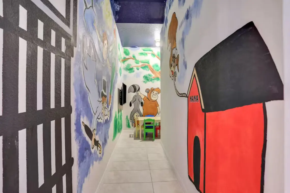 Mural hallway with kids’ play area