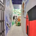 Mural hallway with kids’ play area