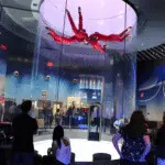 Guests watching indoor skydiving flight at iFLY Orlando