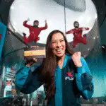 Woman celebrating after indoor skydiving at iFLY Orlando