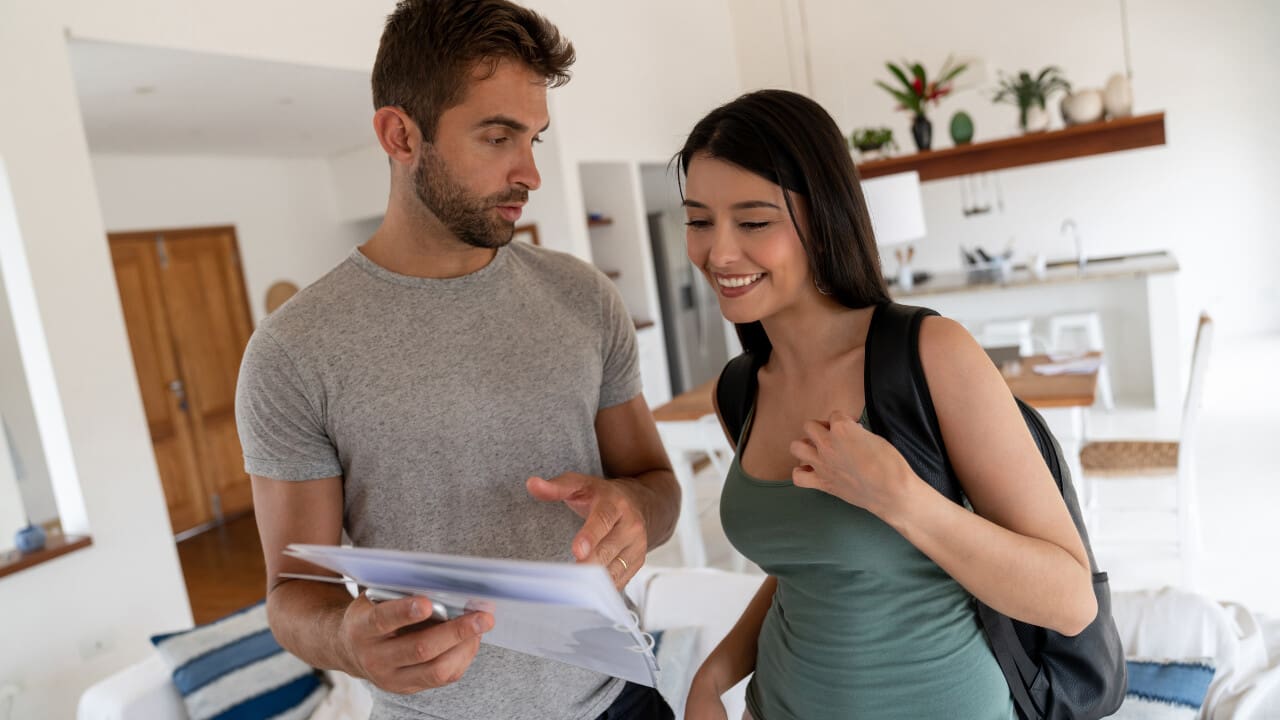 Couple reading house rules.