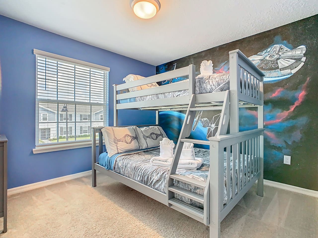 Kids’ room with space-themed bunk bed